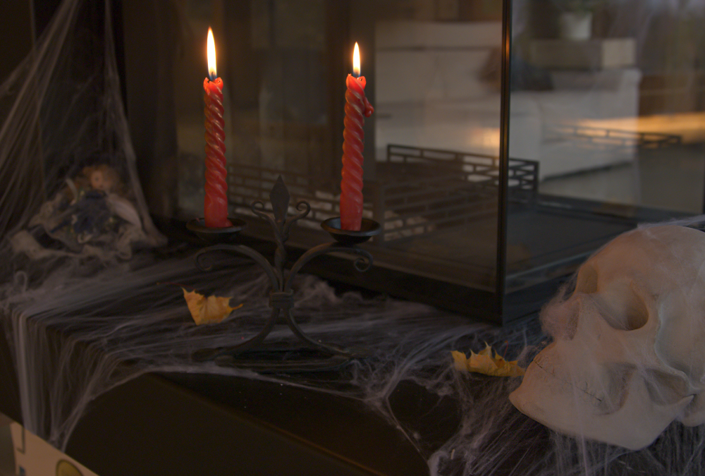 Halloween decor with candles and skull.